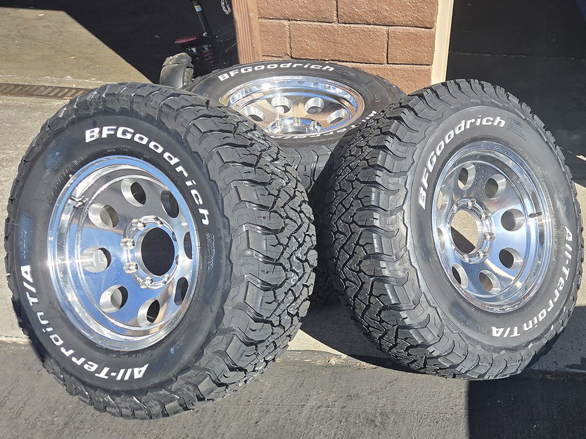Set of new BFGoodrich all-terrain tires on polished wheels at Cal Tire & Auto Repair